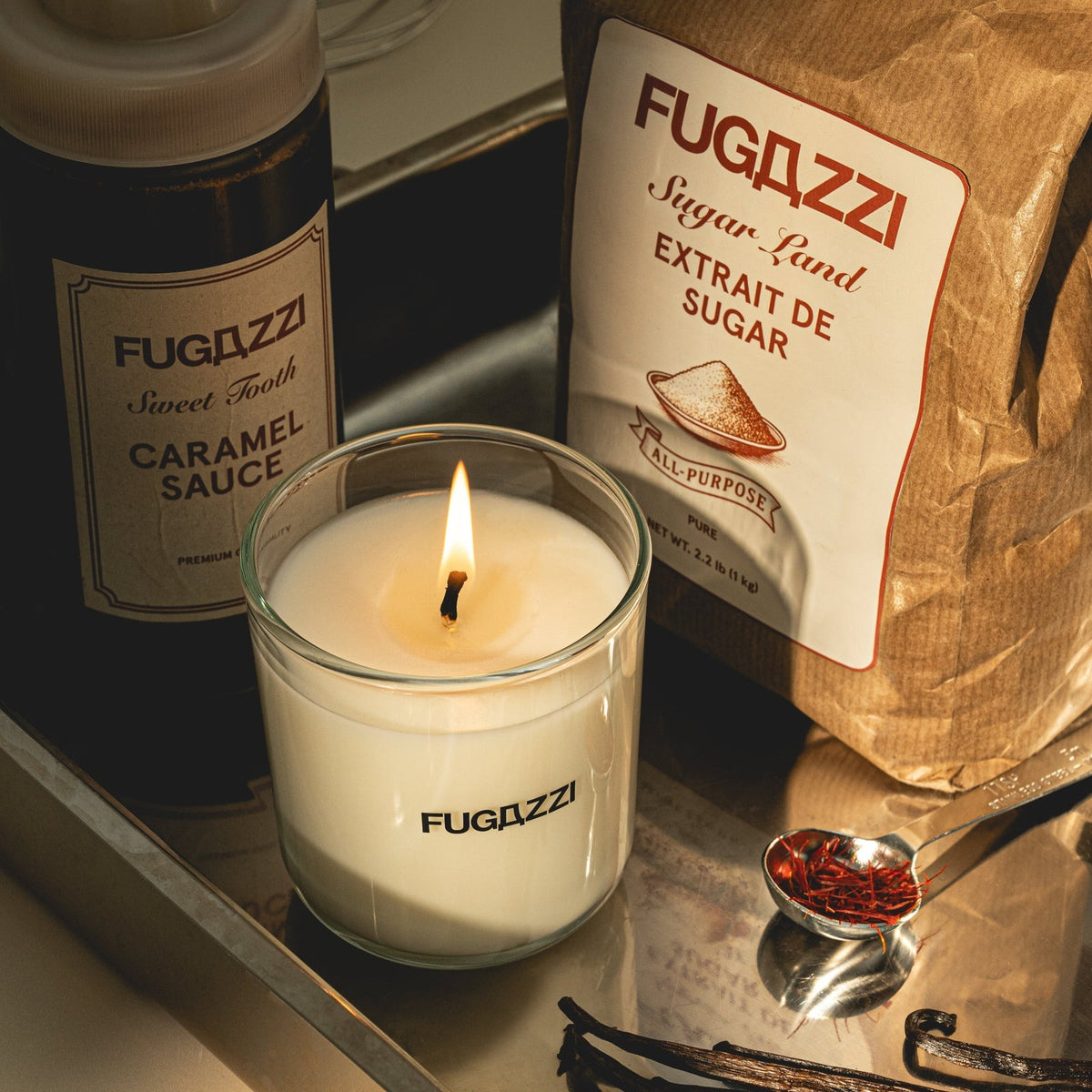 Fugazzi Vanilla Haze Scented Candle — lit candle with vanilla pods